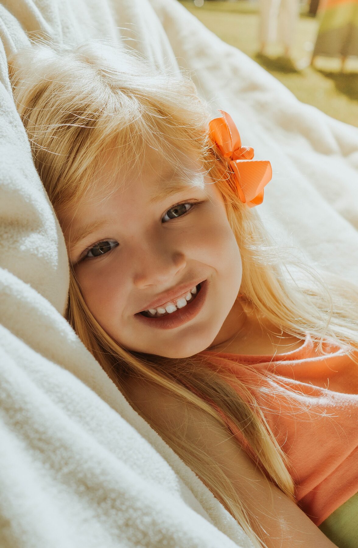 A joyful child photographed in warm natural light